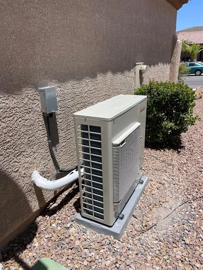 Residential air conditioning condenser unit in Forestville
